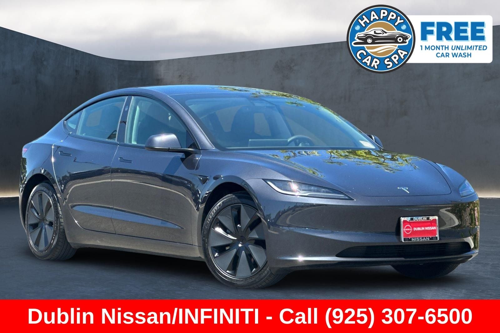 2025 Tesla Model 3 Long Range in Stealth Gray — front three-quarter view